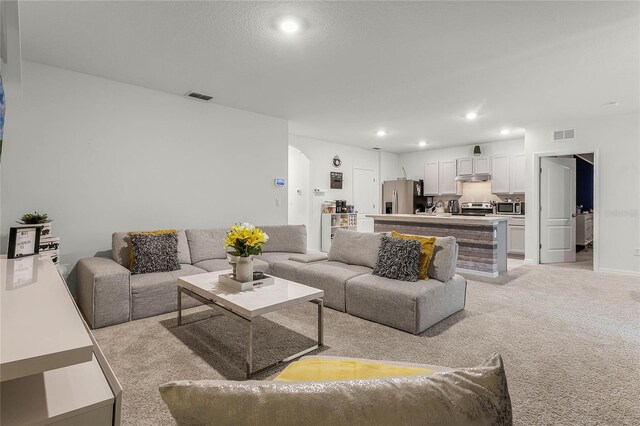 living room with light colored carpet