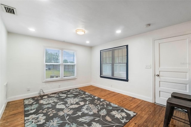 bedroom with dark hardwood / wood-style floors