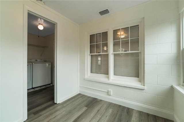 interior space featuring washer and dryer and hardwood / wood-style floors