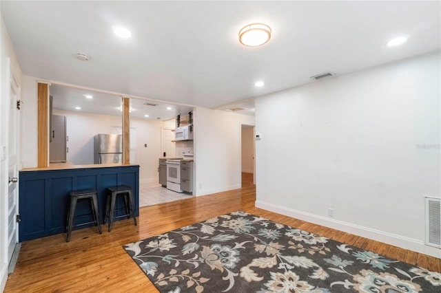 living room featuring light wood-type flooring