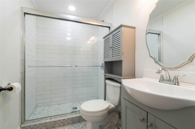 bathroom featuring toilet, ornamental molding, an enclosed shower, and vanity