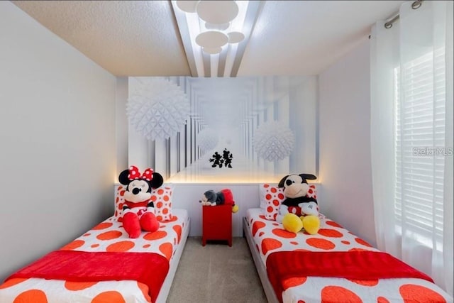 carpeted bedroom with a textured ceiling