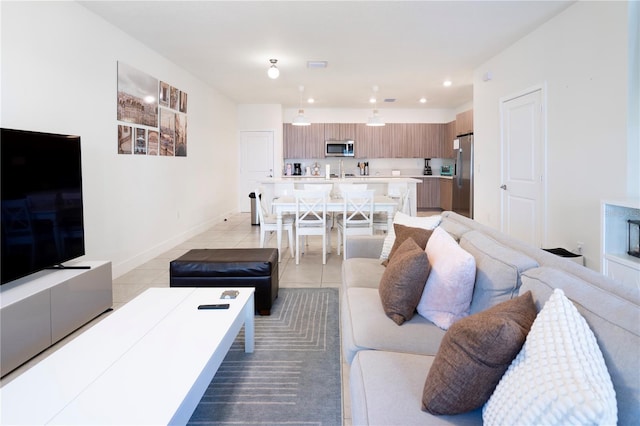 living room with light tile patterned floors