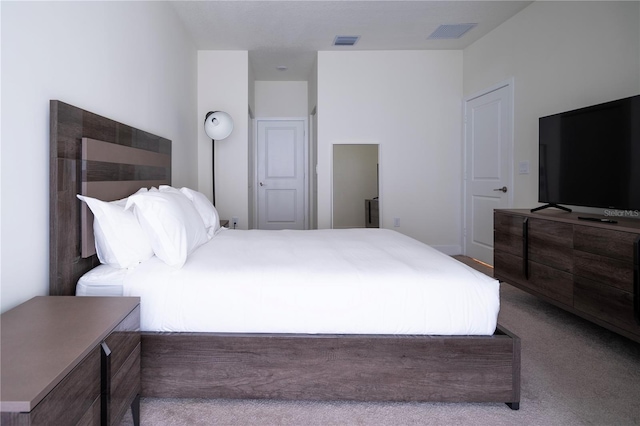 bedroom with light colored carpet