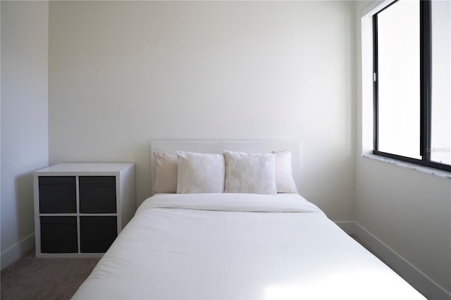 bedroom featuring multiple windows