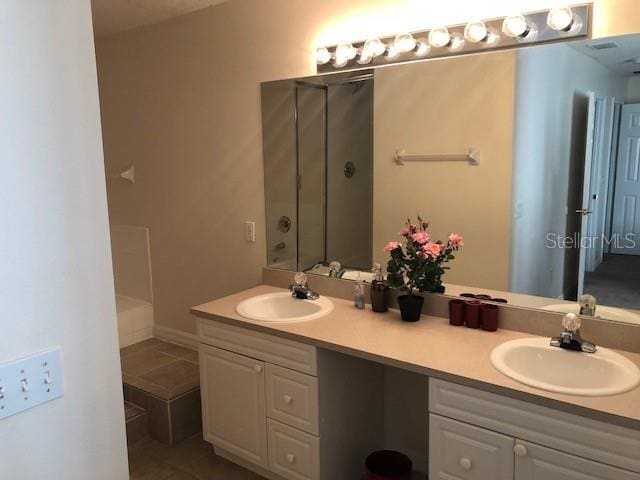 bathroom featuring tile patterned floors and vanity