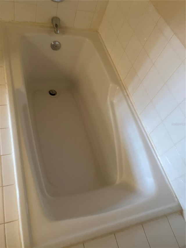 bathroom with tile patterned floors