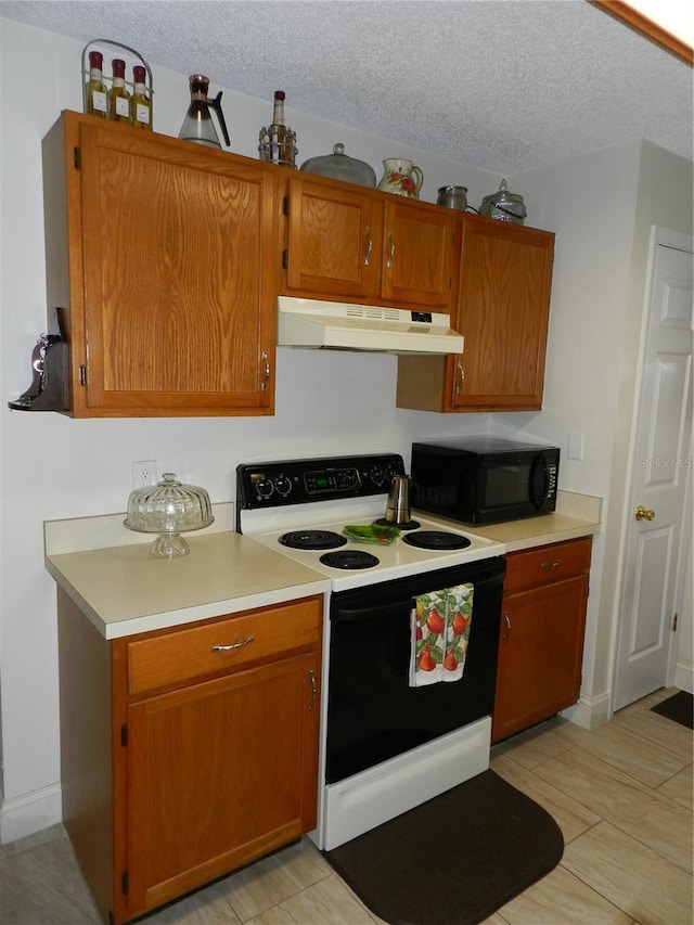 kitchen featuring a textured ceiling and white electric stove