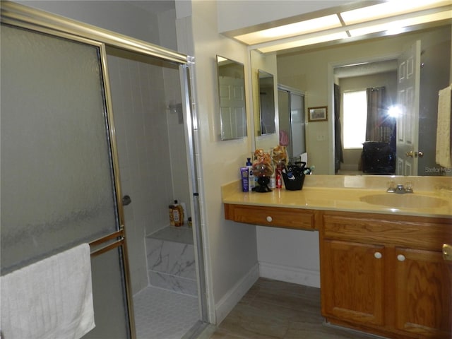 bathroom featuring vanity, tile patterned floors, and walk in shower