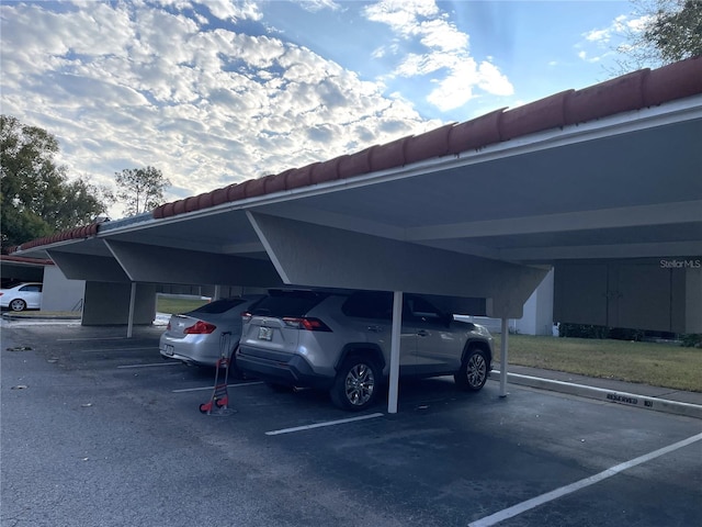 view of parking / parking lot with a carport