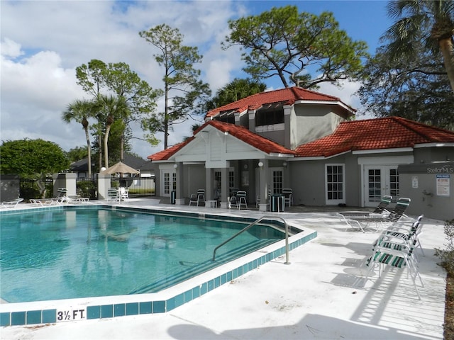 view of swimming pool with a patio area