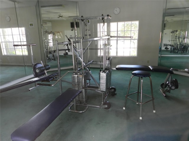 exercise room with ceiling fan