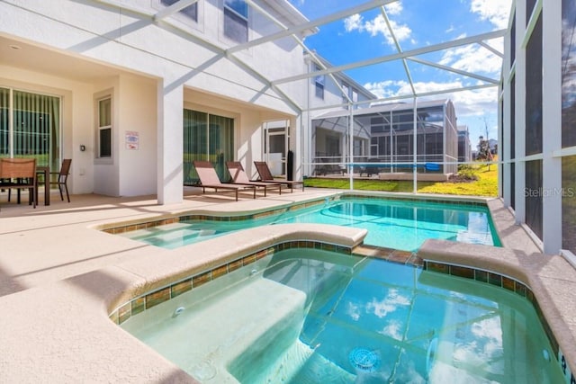 view of swimming pool featuring an in ground hot tub, glass enclosure, and a patio area