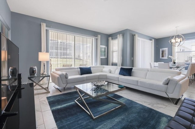 living room with an inviting chandelier