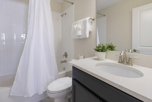 full bathroom with shower / bath combo, toilet, and vanity