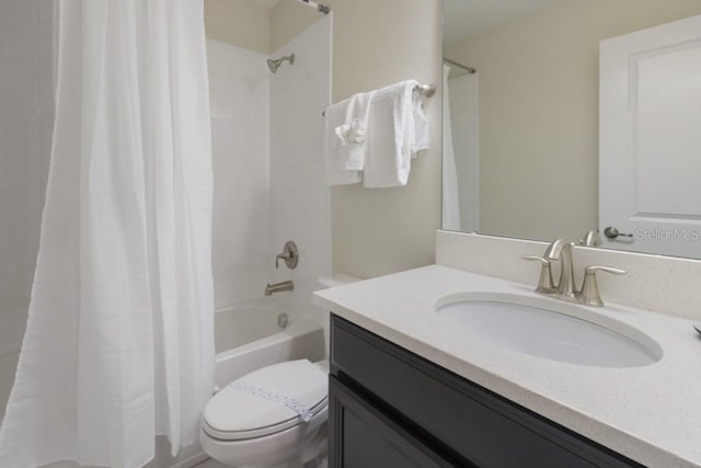 full bathroom with shower / tub combo, vanity, and toilet