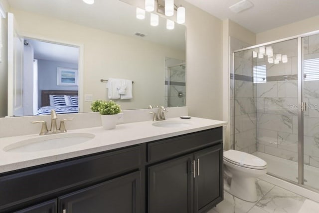 bathroom with vanity, toilet, and walk in shower