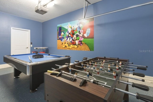 rec room with a textured ceiling and billiards