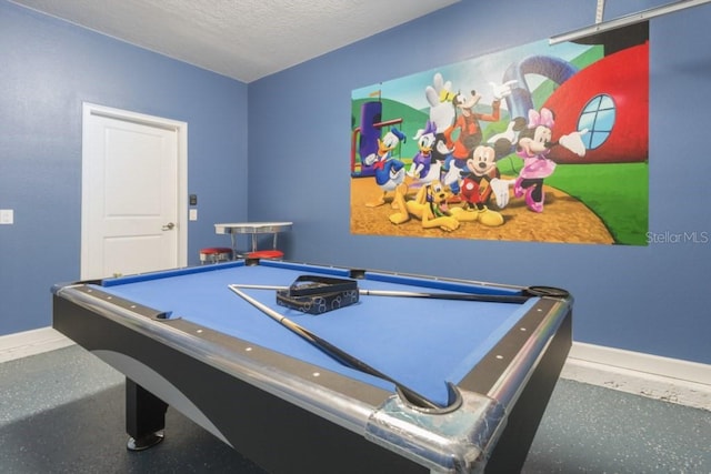 playroom with a textured ceiling and pool table