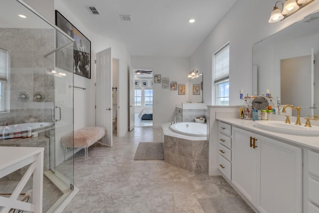 full bathroom with vanity, ceiling fan, toilet, and shower with separate bathtub