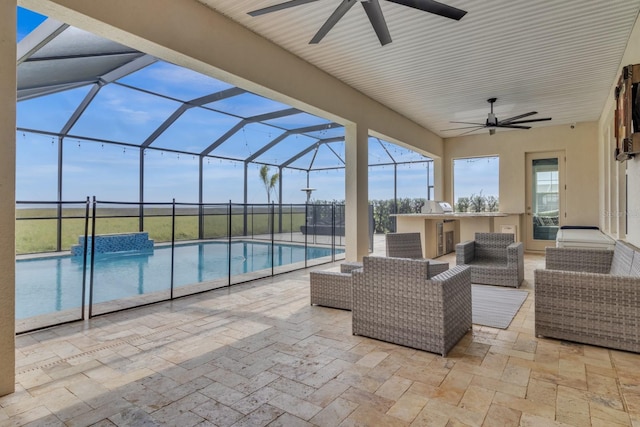 view of patio / terrace featuring an outdoor kitchen, a lanai, and an outdoor hangout area