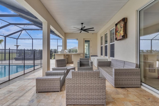 view of patio with an outdoor living space, glass enclosure, an outdoor bar, and ceiling fan