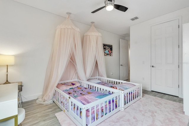 bedroom featuring ceiling fan and light hardwood / wood-style floors