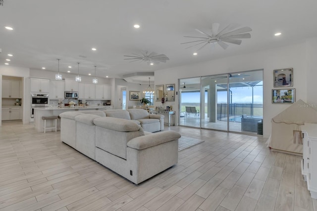 820 Windlass Ct, Kissimmee, FL 34746 - living area featuring light wood-style flooring, a ceiling fan, and recessed lighting