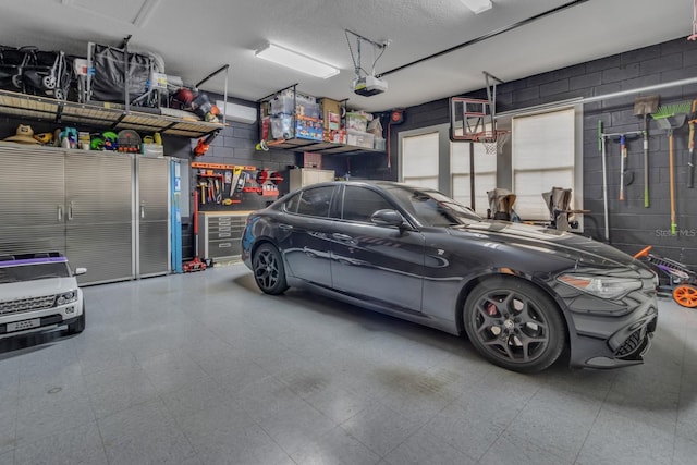820 Windlass Ct, Kissimmee, FL 34746 - garage featuring concrete block wall and a garage door opener