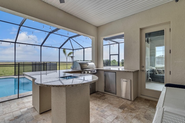 820 Windlass Ct, Kissimmee, FL 34746 - view of patio with glass enclosure, exterior kitchen, grilling area, and an outdoor pool