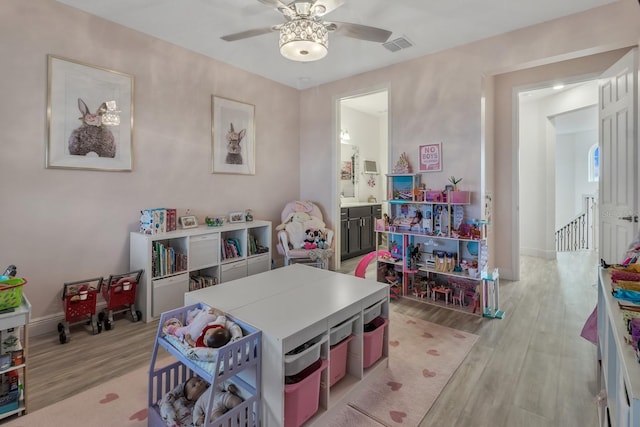 820 Windlass Ct, Kissimmee, FL 34746 - playroom featuring ceiling fan, light wood-type flooring, visible vents, and baseboards