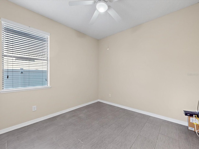 spare room with ceiling fan