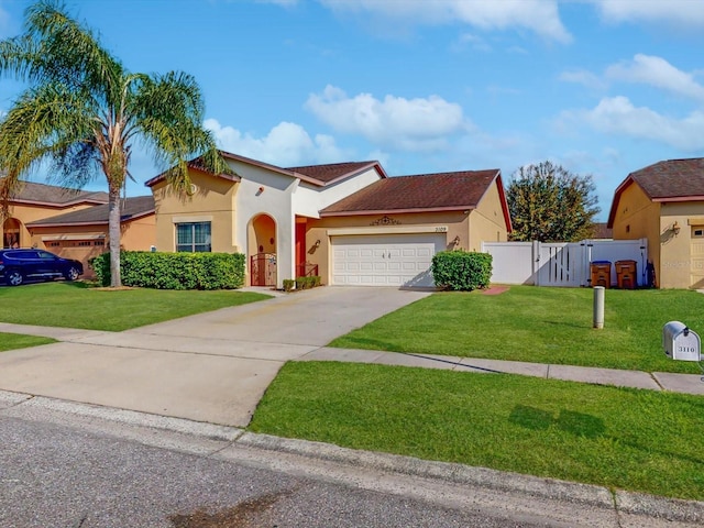 view of front of house featuring a garage and a front yard