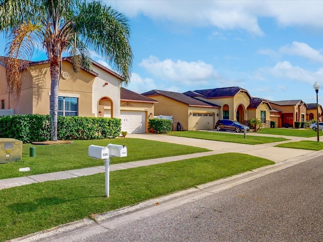 mediterranean / spanish-style home featuring a garage and a front lawn