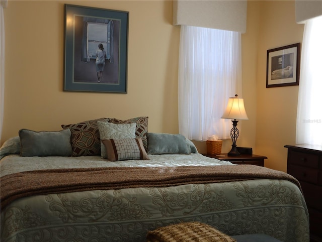 bedroom featuring multiple windows