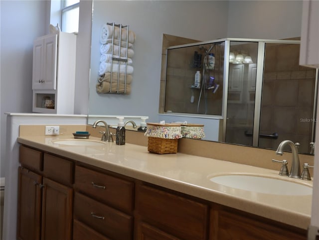 bathroom with vanity and an enclosed shower