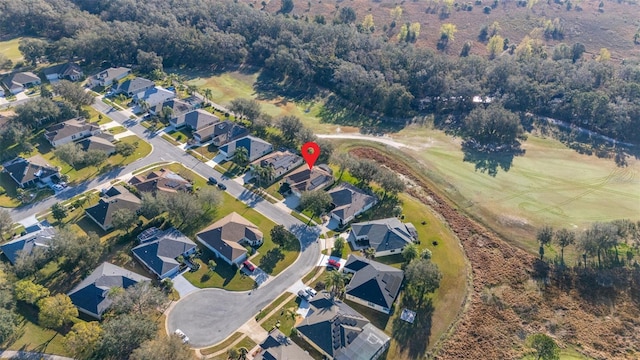 birds eye view of property with a residential view