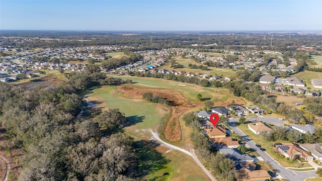 bird's eye view with view of golf course and a residential view