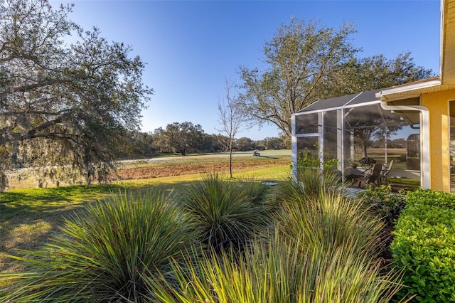 view of yard featuring a sunroom