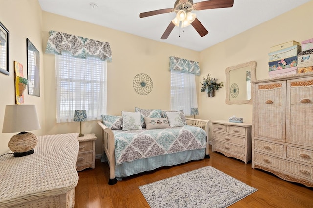 bedroom with a ceiling fan and wood finished floors