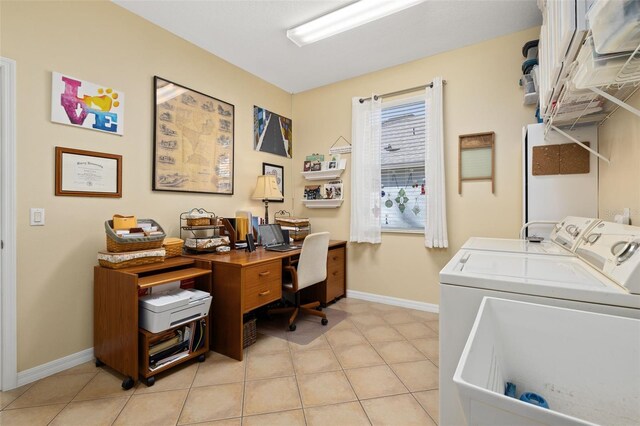 home office with washer and clothes dryer, baseboards, and light tile patterned floors