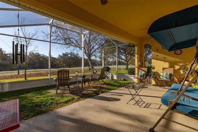 view of patio featuring a lanai