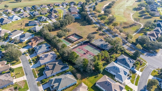 birds eye view of property with a residential view