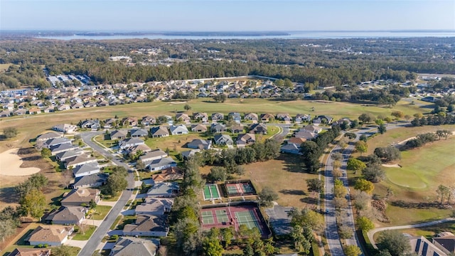 birds eye view of property featuring golf course view and a residential view