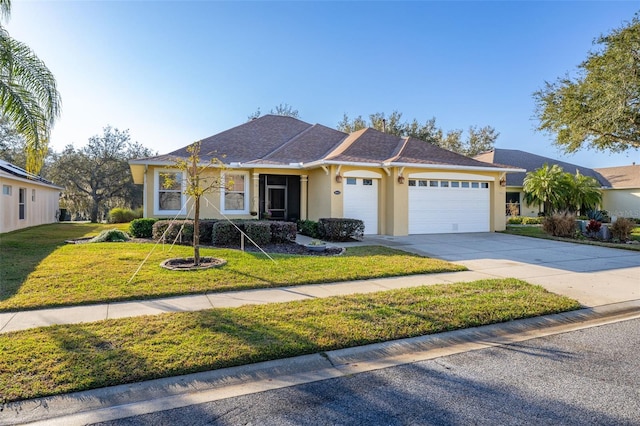 ranch-style home featuring an attached garage, concrete driveway, a front yard, and stucco siding