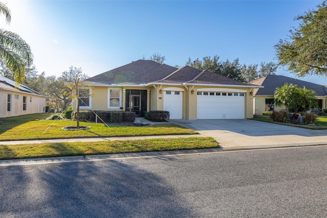 ranch-style home featuring a front lawn, concrete driveway, an attached garage, and stucco siding