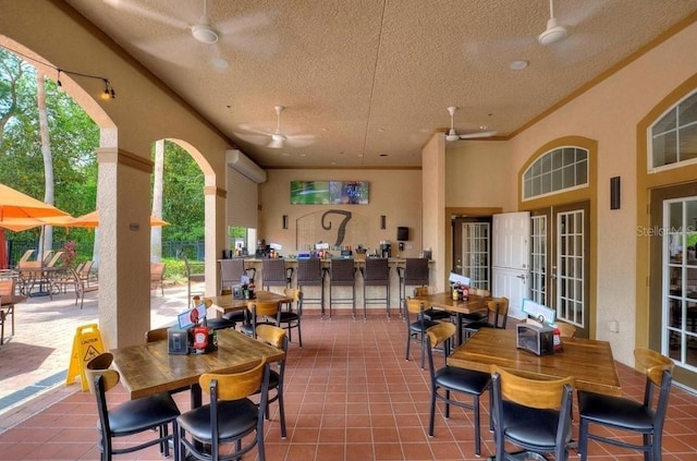 view of patio featuring ceiling fan and an AC wall unit