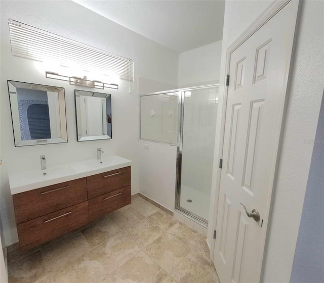 bathroom with vanity and an enclosed shower