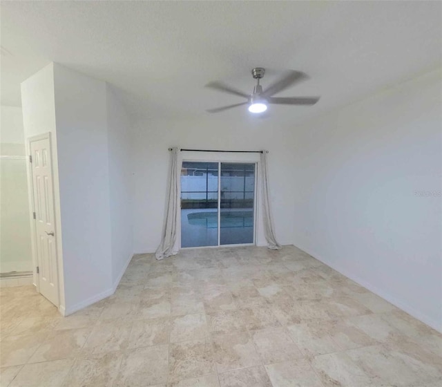 empty room featuring ceiling fan