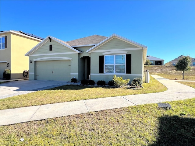 ranch-style house featuring a front lawn and a garage